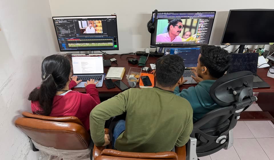The team reviewing a cut at the edit desk