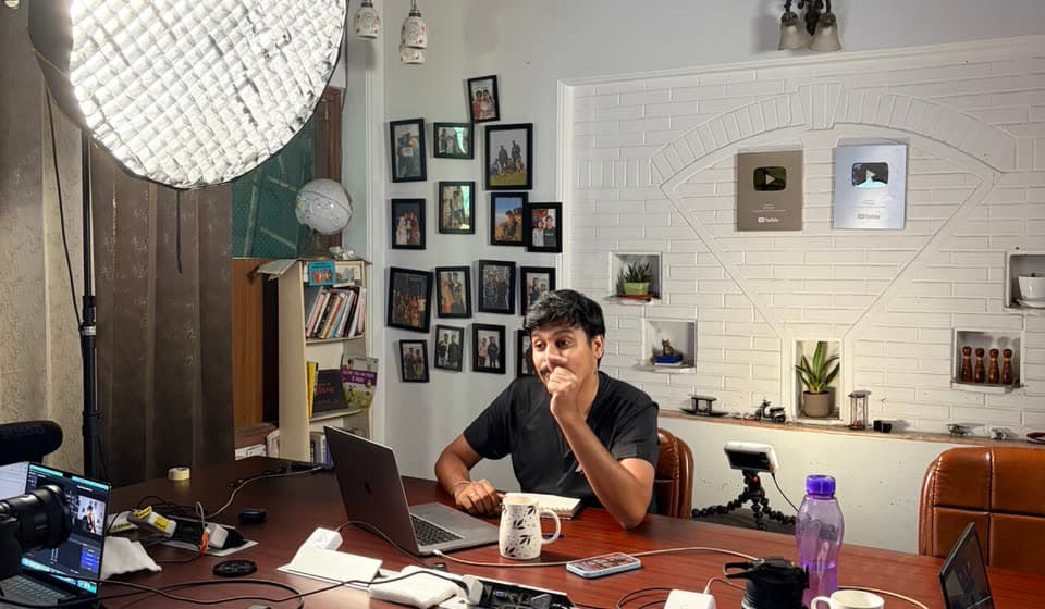 Filming a session at the office table under a softbox