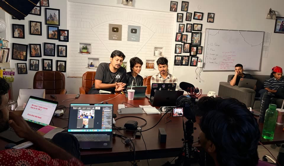 Three hosts running a session while the crew films